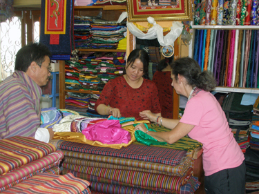 Sheila choosing blouse & material in haberdasher