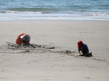 Children play in the sand